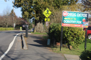 A "No Drug Detox Next to Dorothy Fox" sign points to the site of Fairgrate Estates in Camas' Prune Hill neighborhood, where Discover Recovery hopes to open a 15-bed, inpatient drug treatment and recovery center, on March 16, 2021. (Post-Record file photo)