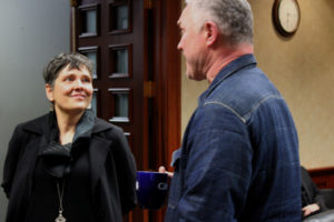 Ellen Burton (left) talks to Camas Community Development Director Phil Bourquin inside Camas City Hall in January 2019. (Kelly Moyer/Post-Record file photo)