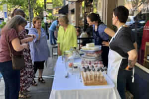 Visitors to Camas' Third Thursday in June 2021 visit the Moments Of Magic Bakery pop-up shop outside Papermaker Pride to sample assorted baked goods and desserts. (Contributed photo courtesy of the Downtown Camas Association)