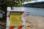 A toxic-algae warning sign is posted next to Lacamas Lake in Camas on July 20, 2020. (Kelly Moyer/Post-Record files)