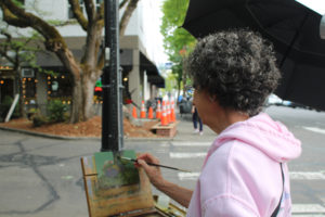 Artist Beth Norwood works on an oil painting during the 2021 Plein Air art event on Friday, Sept. 3, 2021. (Kelly Moyer/Post-Record files)