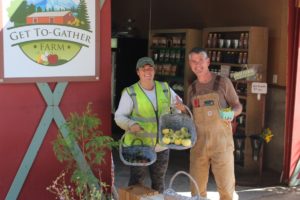 Andra Spencer (left) and John Spencer, show a recent harvest of fruit from their Washougal Get To-Gather retail farm stand on Sept. 2, 2021.
Top: Flowers are in bloom at the Get To-Gather farm on Sept. 2, 2021. (Photos by Doug Flanagan/Post-Record)