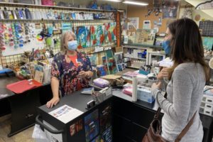 Tamara Dinius (left) talks with a customer at her Washougal studio in 2021. Dinius is one of 10 artists participating in the inaugural Washougal Studio Artists Tour Holiday Art Market, set for Saturday and Sunday, Nov. 13-14, 2021. (Contributed photo courtesy of Rene Carroll)