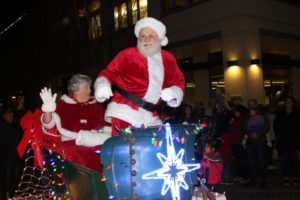 Santa and Mrs. Claus wave from an illuminated float during the 2019 Washougal Lighted Christmas Parade. The annual parade was canceled in 2020 due to the COVID-19 pandemic, but is back this year and set to begin at 6 p.m. Thursday, Dec. 2, 2021, on Main Street in downtown Washougal. (Doug Flanagan/Post-Record files)