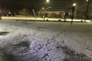 Footprints in freshly fallen snow lead away from the 7 Market in Camas on Dec. 28, 2021. Police followed the footprints through the neighborhood and discovered two burglary suspects carrying backpacks filled with stolen goods. (Contributed photo courtesy of the Camas and Washougal police departments)