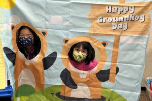 Dorothy Fox Elementary School students Emmerson Chan (left) and Emma Hilliard (right) pose for a photo during a Groundhog Day celebration at their Camas school on Wednesday, Feb. 2, 2022. (Photo courtesy of Julie Savelesky)