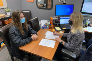 Kathy Scobba (right), the Washougal School District's career specialist and worksite learning coordinator, interviews Washougal High School senior Isabella Juhl (left) for a "security position" as part of a project for the school's introduction to medical careers and terminology class. College and career readiness are prioritized in WSD's strategic plan, which is undergoing a "mid-point check-in" process to better understand how the public thinks the school district is doing. (Contributed photo courtesy of the Washougal School District)