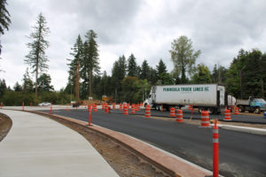 A truck travels through the partially  completed roundabout at Everett Street and Lake Road in Camas on Aug. 21, 2020. (Kelly Moyer/Post-Record files)