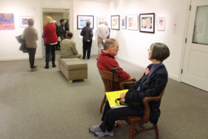 Visitors browse artwork inside the Second Story Gallery, located on the second floor of the Camas Public Library, on Feb. 2, 2019. (Kelly Moyer/Post-Record files)