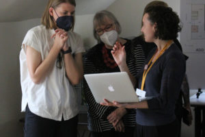 Hacker Architects employee Marissa Jordan (left), Fort Vancouver Regional Library executive director Amelia Shelley (center) and Washougal Community Library manager Rachael Ries (right) talk about the new Washougal library during a public meeting at the Children's Home Society of Washington in Washougal, on March 16, 2022. (Doug Flanagan/Post-Record)