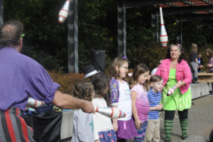 Jugglers Charlie Brown (left) and Zephyr Brown (right) entertain children at the Washougal "Eggstravaganza" event on March 28, 2018. The city of Washougal has rebranded the event and will hold its first "Hello Spring" community fair at Hathaway Park on Saturday, April 30, 2022. (Post-Record file photo)