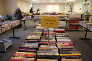 Visitors peruse used books during the Friends and Foundation of the Camas Library's December 2019 book sale at the Camas library. (Kelly Moyer/Post-Record files)