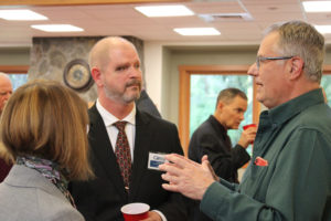 Jeff Niten, city manager for the city of Shelton, Wash. (center), one of four applicants being considered as the city of Camas' next city administrator, speaks with the Downtown Camas Association Board of Directors' president, Sarah Laughlin (left), and vice president Randy Curtis (right) during an open house at Lacamas Lake Lodge on Thursday, May 12, 2022. (Kelly Moyer/Post-Record files) 