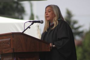 Washougal High School Principal Sheree Gomez-Clark delivers a commencement address during the school's graduation ceremony on Saturday, June 11, 2022. (Doug Flanagan/Post-Record)