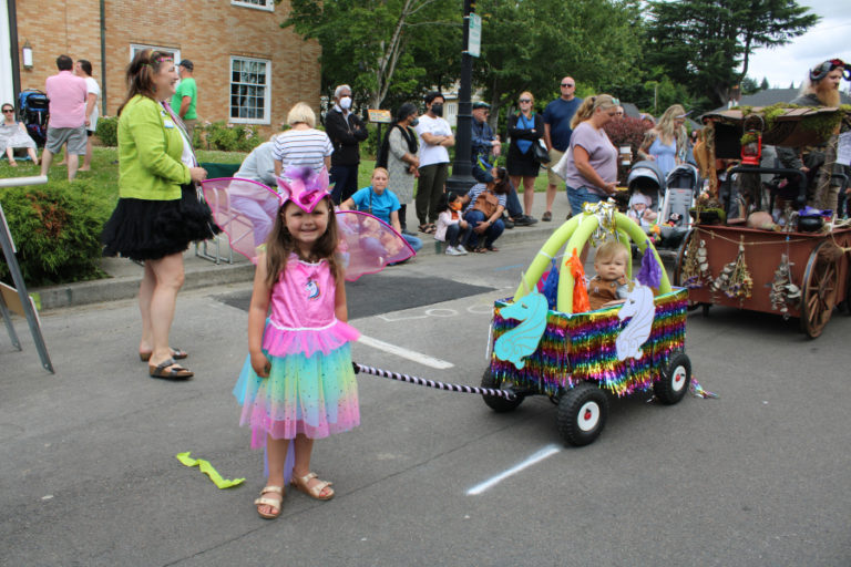 Children line up in front of the Camas Public Library Friday, July 22, 2022, before the start of the 2022 Camas Days Kids Parade.