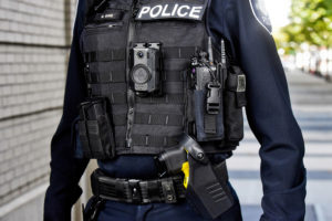 Contributed photo courtesy of AXON 
 An officer models the type of AXON body-worn camera and taser Camas police officers began wearing in April 2022. The city of Washougal is hoping to launch a body-worn camera program of its own in early 2023.