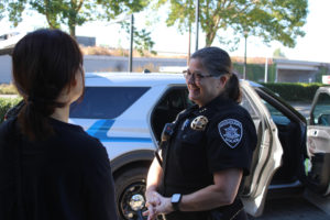 Washougal Police Chief Wendi Steinbronn (right) talks with community members during the annual Coffee with a Cop event at the Washougal Starbucks on C Street on Friday, Sept. 23, 2022. (Kelly Moyer/Post-Record files)