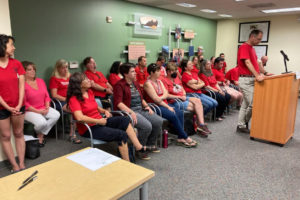 Washougal Association of Educators President James Bennett (right) speaks during a Washougal School Board meeting on Tuesday, Aug. 23, 2022. (Contributed photo courtesy of the Washougal Association of Educators)