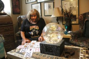 Washougal psychic Kathy Dering performs a reading at her home on Oct. 20, 2022. Dering will appear in a documentary about the annual "Spirit of Halloweentown" celebration that takes place in Dering's hometown of St. Helens, Ore. (Doug Flanagan/Post-Record)