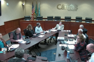 Camas Mayor Steve Hogan (center) and Camas City members (clockwise from lower left): Leslie Lewallen, John Nohr, Bonnie Carter, Greg Anderson, Don Chaney, Tim Hein and Marilyn Boerke, along with interim Camas City Administrator Jeff Swanson (lower right), listen to Camas resident Randal Friedman during the public comments portion of a city council workshop held Monday, Nov. 7, 2022. (Screenshot by Kelly Moyer/Post-Record)  