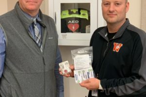 Contributed photo courtesy Washougal School District
Washougal School District assistant superintendent Aaron Hansen (left) and Washougal High School principal Mark Castle (right) display a dose of Narcan, a medication used to assist people who have experienced an overdose of opioids. The Washougal School Board recently approved a policy that states that Narcan will be placed in every one of the district's schools.