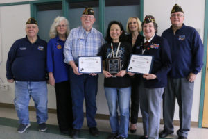 Alice Yang (fourth from left) stands with (left to right) Gary Andreas, Marjorie Stetson, Sonny Liston, Mary Templeton, Dana Difford and Bob Hitchcock during a ceremony at Cape Horn-Skye Elementary and Canyon Creek Middle schools on Tuesday, Jan. 17, 2023. (Contributed photo courtesy of the Washougal School District)