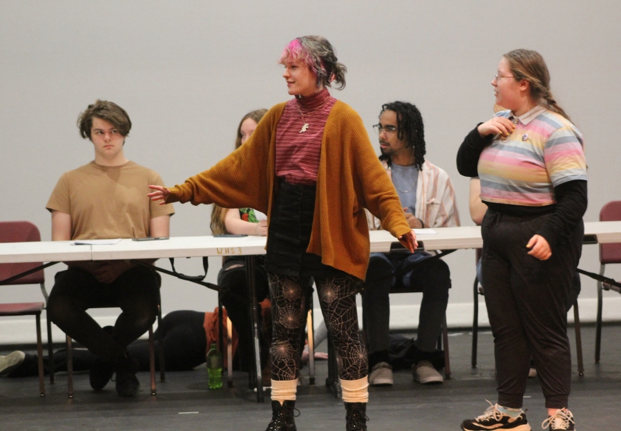 Toby Nicholson (center) speaks while (from left to right) Brody Lokken, Chloe Dahler, Aundre Pitts and Em Wade look on during a rehearsal for Washougal High School's upcoming "Oh, What a Knight" dinner theater production on Thursday, Feb. 2, 2023.