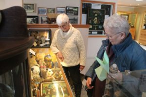 Two Rivers Heritage Museum board president Tish Bayer (left) and volunteer Karen Johnson (right) look at the Washougal museum's teddy bear display on Friday, Feb. 17, 2023. (Photos by Doug Flanagan/Post-Record)