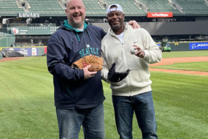 Washougal resident John Scukanec (left) poses for a photo with former Seattle Mariners outfielder and Major League Baseball Hall of Famer Ken Griffey Jr. Wednesday, March 1, 2023 at T-Mobile Park in Seattle. (Contributed photo courtesy of John Scukanec)