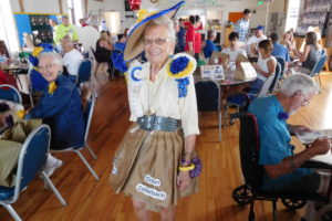 Camas historian Virginia Warren shows off her paper dress during the 2018 luncheon for current and former members of the Camas Days Royal Court in July 2018. Warren will tell stories about Camas' history from 4 to 5 p.m. Friday, April 7, at Caffe Piccolo in downtown Camas, during the Downtown Camas Association's 