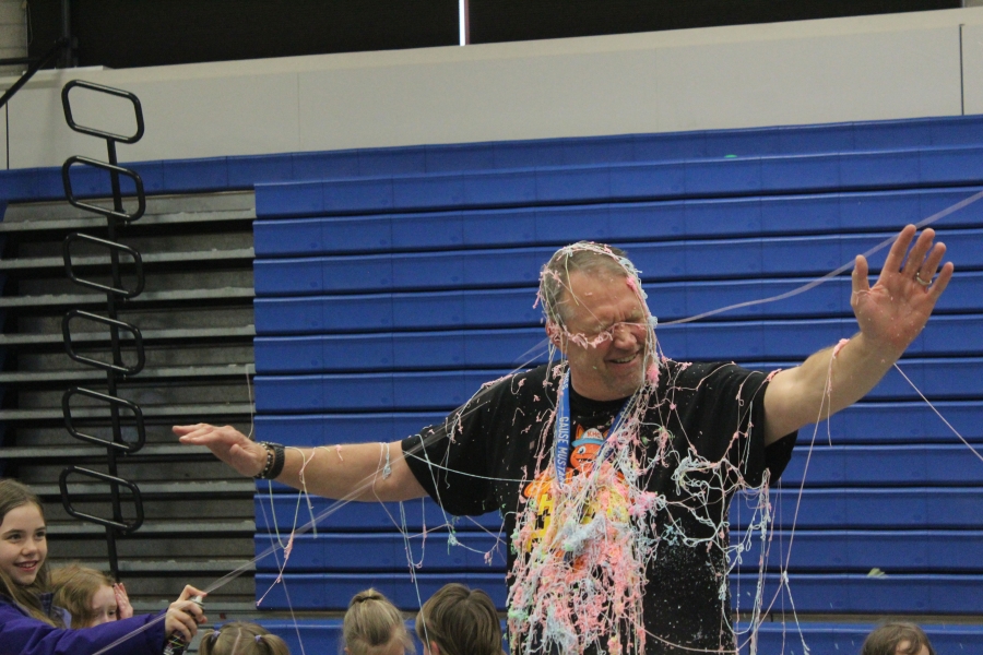 Gause Elementary School students spray physical education teacher Mark Bauer with "silly string" on Tuesday, March 28, 2023. (Photos by Doug Flanagan/Post-Record)