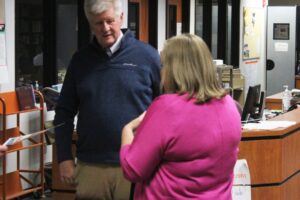 Washougal School Board member Jim Cooper (left) talks to Hathaway Elementary School Principal Wendy Morrill (right) during the school district's March 28, 2023, at Washougal High School. (Doug Flanagan/Post-Record files)