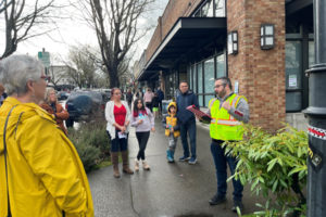 Brad Richardson (right), the executive director of the Clark County Historical Museum, leads a walking history tour throughtout downtown Camas during the Downtown Camas Association's 