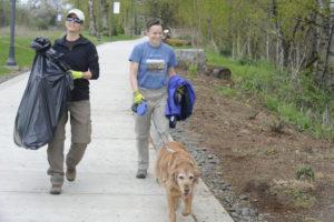 Deanna Eichler (left) and Leslee Froehlich of Washougal participate in the Port of Camas-Washougal's Earth Day cleanup day with their golden retriever, Zoe, in April 2018. (Post-Record file photo)