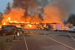 An adult family living center burns Tuesday morning north of Camas. Ten residents were displaced and the building was destroyed. (Photo contributed by East County Fire & Rescue)