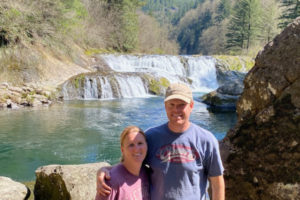 Erika Leavitt (left) and her husband, Joshua, gather near their rural Washougal residence. Airbnb recently named Erika, who has been hosting short-term guests in her Washougal cottage since 2020, as the state's 