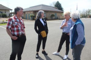 Port of Camas-Washougal commissioners John Spencer (far left) and Cassi Marshall (second from left) talk with Zielonki, Poland, resident Roma Toft (second from right) and Washougal city councilwoman Molly Coston (far right) in front of the Port's administrative office in May. (Doug Flanagan/Post-Record)