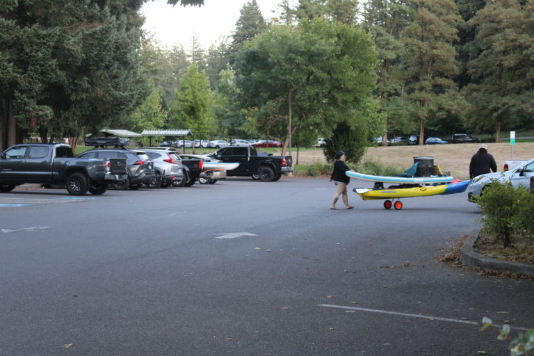 Paddleboarders return to their vehicle at Heritage Park in Camas Thursday, Sept. 14, 2023.