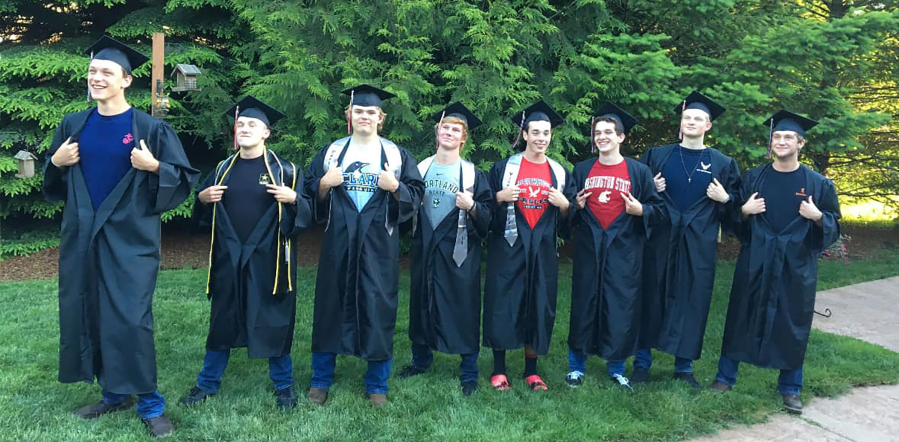 Contributed photo courtesy Lori Webb
Washougal High School graduate Alec Langen (far left) opens his robe to display a United States Marines shirt at the school’s graduation ceremony in 2018.
