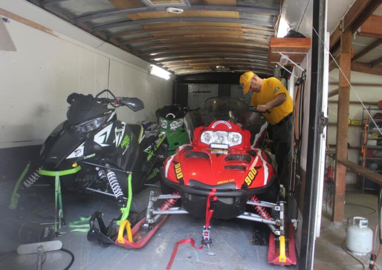 Doug Flanagan/Post-Record 
 Silver Star Search and Rescue rescue coordinator Rick Blevins examines one of the organization&#039;s snowmobiles at East County Fire and Rescue&#039;s Station 92 on May 13.