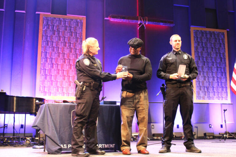 Camas Police Chief Tina Jones (left) presents a Civilian Service Award to Walter Collins (center) and a Lifesaving Medal to Camas police officer Wade Ramsey (right) during the Camas Police Department&rsquo;s inaugural awards ceremony at Grace Foursquare Church in Camas, Thursday, May 23, 2024.