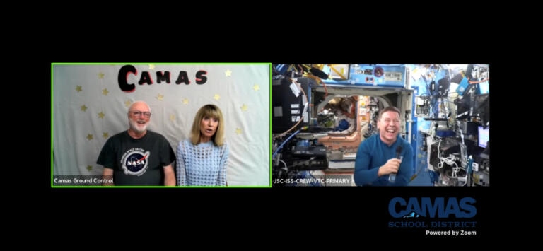 NASA astronaut Dr. Michael Barratt (right) speaks to his former Camas teachers, Dale Croswell (left) and Gail Welsh (center) via a remote video feed, Thursday, May 23, 2024.