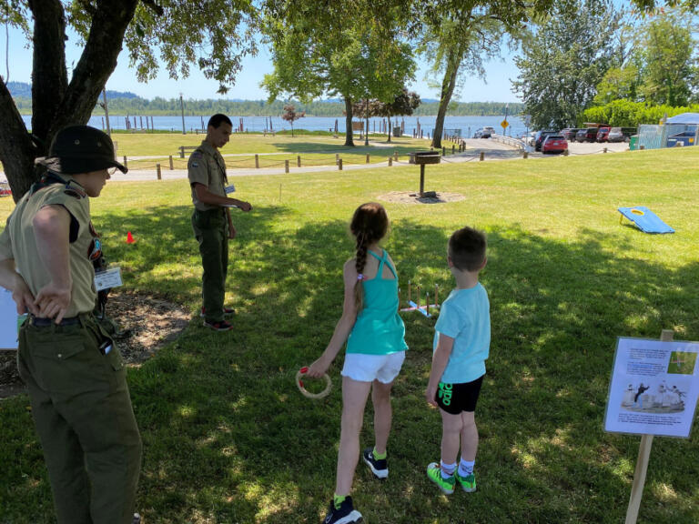 Contributed photo courtesy Rene Carroll 
 Children play a ring-toss game during the 2023 Parkersville Day event in Washougal.