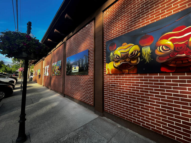 Artwork by Camas-area students adorns a building at the intersection of Northeast Cedar and Northeast Fifth Avenue in downtown Camas. The new Camas Culture Art Block held a ribbon-cutting May 17, 2024.