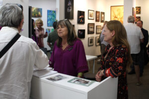 Gallery 408 owners Kim Nickens (center) and Michelle Purvis (right) greet visitors at the Camas gallery, Friday, May 31, 2024. (Photos by Kelly Moyer/Post-Record)