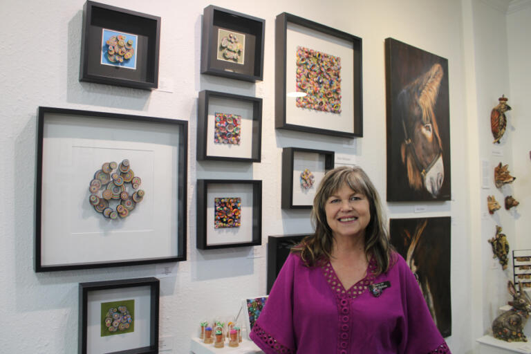 Gallery 408 owner Kim Nickens stands near her quilling art during the gallery's grand opening, Friday, May 31, 2024.