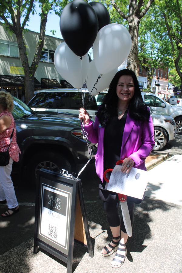 Camas-Washougal Chamber of Commerce Director Jennifer Senescu attends the ribbon-cutting for the grand opening of Gallery 408 in downtown Camas, Friday, May 31, 2024.