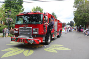 A Camas-Washougal Fire Department fire truck makes its way down Northeast Fourth Avenue in downtown Camas, as it leads the 2022 Camas Days Kids Parade, Friday, July 22, 2022. (Kelly Moyer/Post-Record files)