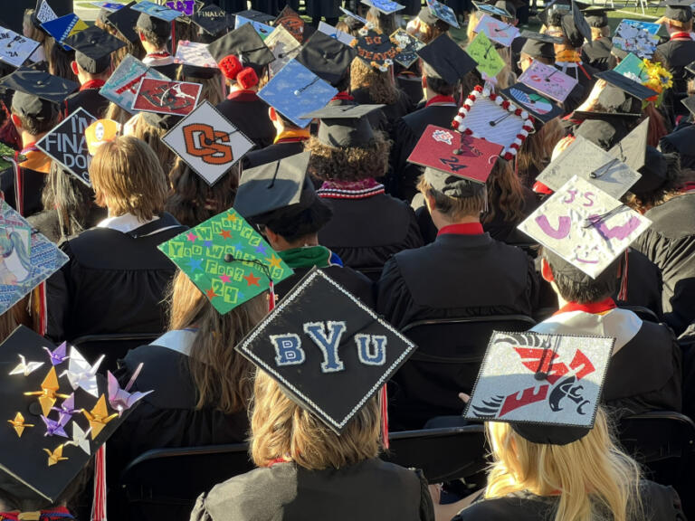 Camas High School 2024 graduates show off decorated mortarboards during the school&rsquo;s commencement ceremony at Doc Harris Stadium, Friday, June 7, 2024.