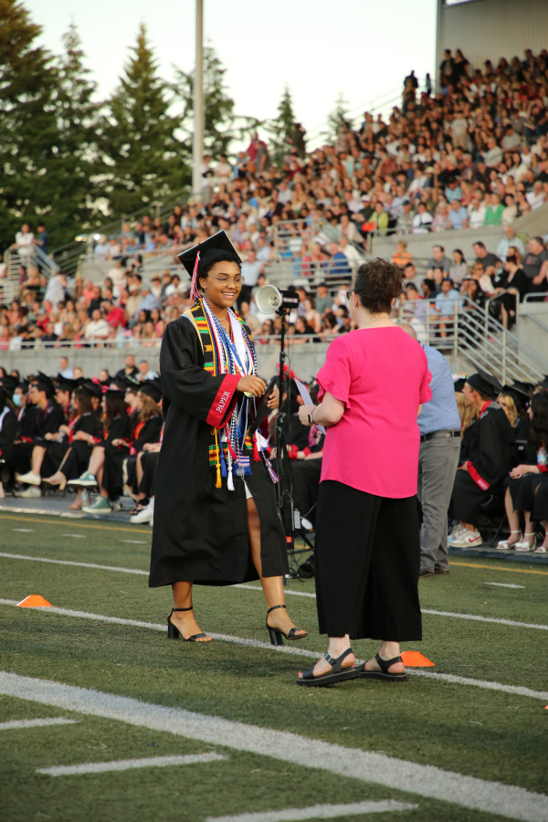 Photo by Doreen McKercher, courtesy of the Camas School District 
 Camas High School 2024 graduate Sophia Wade receives her diploma during the school&#039;s commencement ceremony at Doc Harris Stadium, Friday, June 7, 2024. (Photo by Doreen McKercher, courtesy of the Camas School District)